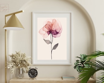May include: A framed print of a watercolor painting of a single pink and purple flower with a stem and leaves on a light pink background.