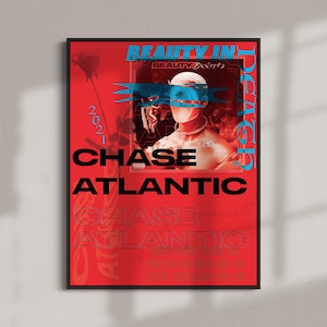 May include: A red poster with black text that reads "BEAUTY IN DECAY" and "CHASE ATLANTIC" with a smaller image of a person with blue and red hair wearing a blue mask. The text "2021" is in the upper left corner of the poster.