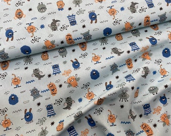 May include: A light blue fabric with a repeating pattern of colorful cartoon monsters. The monsters are all different shapes and sizes and have various facial expressions. The fabric is perfect for crafting projects, such as making clothes, bags, or home decor.