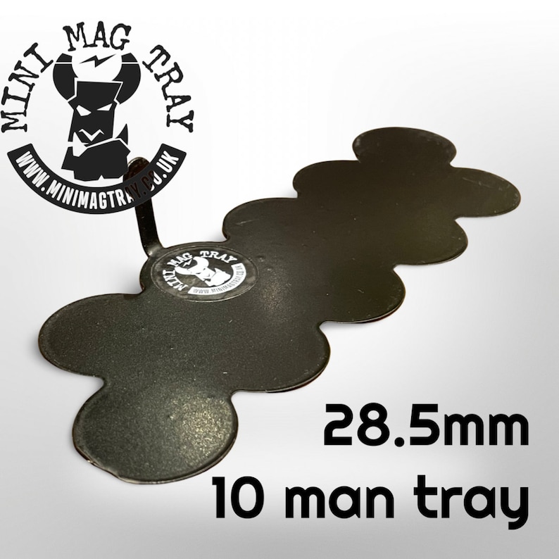 May include: A black metal tray with a unique, multi-lobed design. The tray is labeled "10 man tray" and measures 28.5mm. The Mini Mag Tray logo is visible, along with the website address. The tray is designed to hold small items.