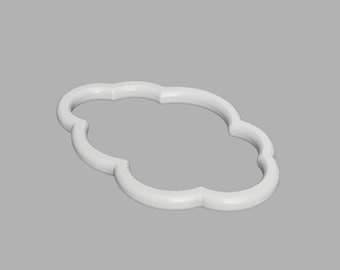 May include: A white, cloud-shaped cookie cutter with a smooth, rounded frame. The object features a continuous, scalloped outline forming a central open space, constructed from a solid, matte material with a uniform, clean, and simple design.