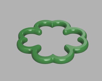 May include: A four-leaf clover shaped frame with a smooth, glossy green finish. The object features a continuous, rounded outline forming a symmetrical, open-centered design with four distinct lobes, presented against a neutral gray background.