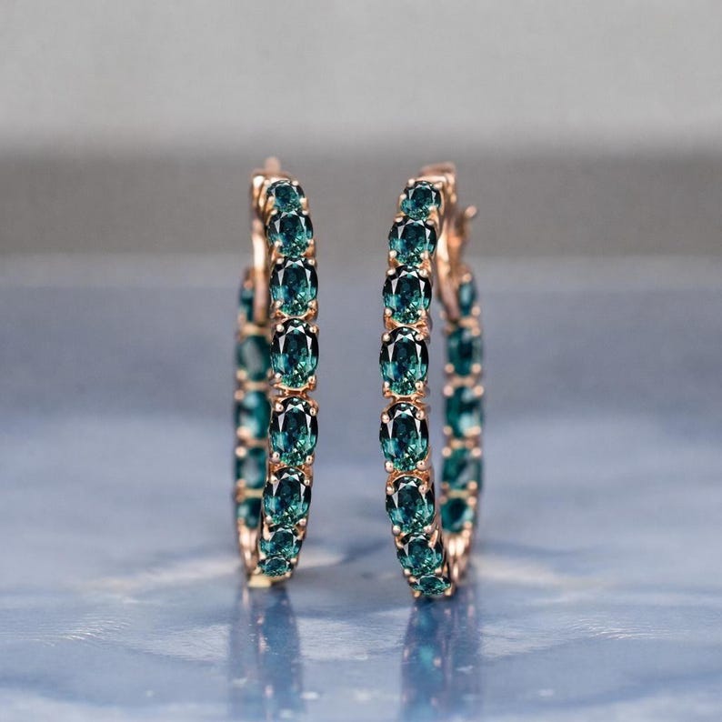 Teal sapphire hoop earrings, teal blue sapphire hoops, sapphire eternity hoop earrings, rose gold sapphire earrings, green blue gemstone hoops, luxury sapphire circle earrings, September birthstone earrings, oval cut sapphire hoops, fine jewelry hoop earrings, anniversary gift for her, statement sapphire earrings, elegant bridal sapphire hoops