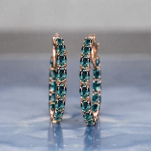 Teal sapphire hoop earrings, teal blue sapphire hoops, sapphire eternity hoop earrings, rose gold sapphire earrings, green blue gemstone hoops, luxury sapphire circle earrings, September birthstone earrings, oval cut sapphire hoops, fine jewelry hoop earrings, anniversary gift for her, statement sapphire earrings, elegant bridal sapphire hoops