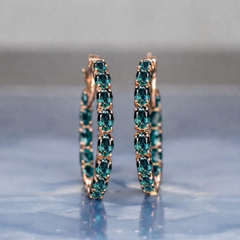 Teal sapphire hoop earrings, teal blue sapphire hoops, sapphire eternity hoop earrings, rose gold sapphire earrings, green blue gemstone hoops, luxury sapphire circle earrings, September birthstone earrings, oval cut sapphire hoops, fine jewelry hoop earrings, anniversary gift for her, statement sapphire earrings, elegant bridal sapphire hoops