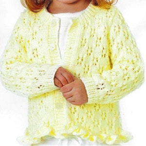 May include: A yellow knitted cardigan with a button closure and a lacy pattern.