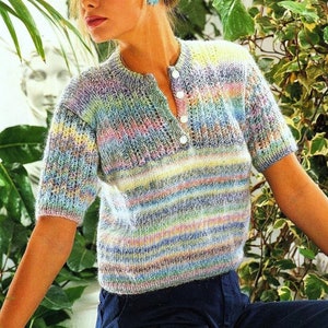 May include: A striped, multi-colored, short-sleeved sweater with a single button closure at the neckline.