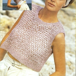 May include: A pink crocheted sleeveless top with a delicate openwork pattern. The top is cropped and has a round neckline.