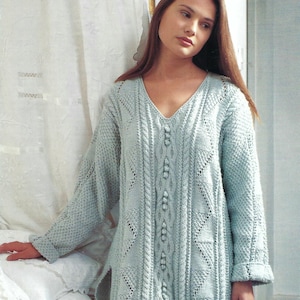 May include: A light blue knitted sweater with a V-neck and a button-up front. The sweater has a delicate lace pattern and a cable knit design.
