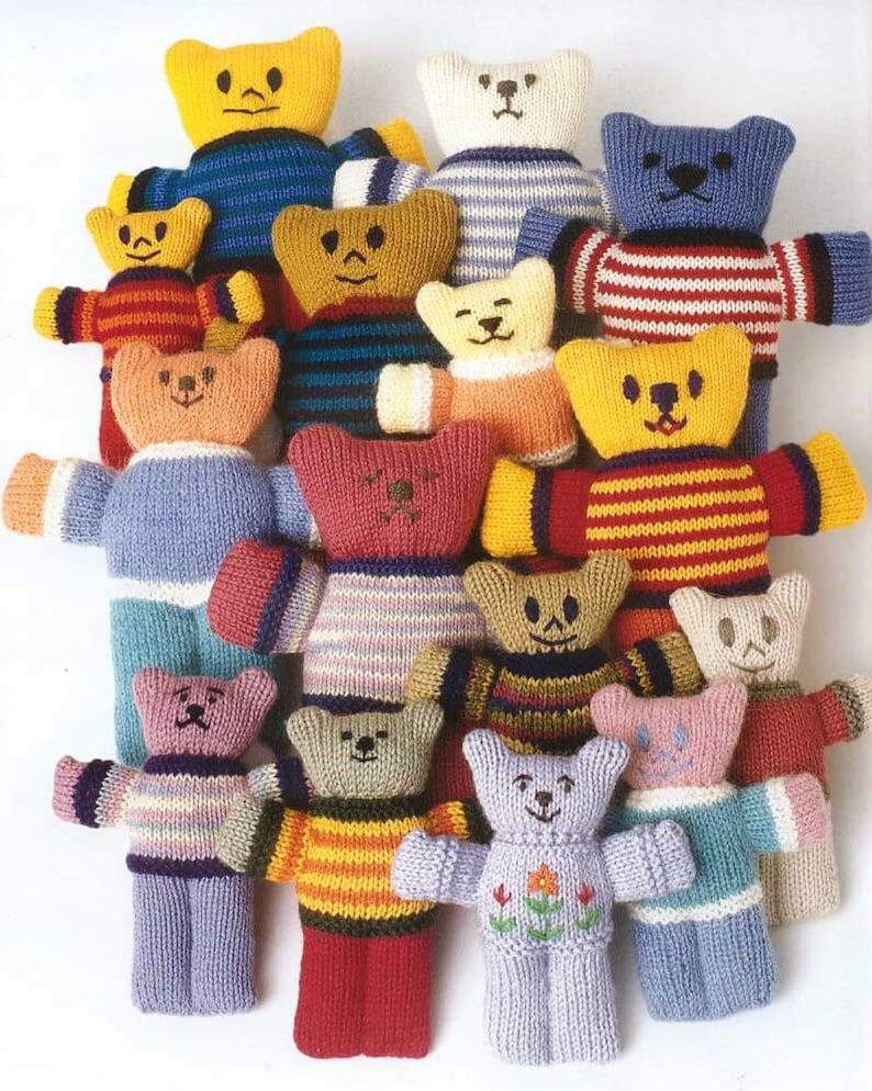 May include: A collection of handmade knitted teddy bears in various colors. Each bear has a unique striped or solid-colored sweater and embroidered facial features. The bears are arranged closely together, showcasing a variety of designs and color combinations.
