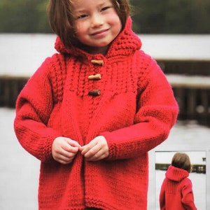 May include: A red knitted hooded jacket with a toggle closure and a cable knit pattern. The jacket is worn by a child.