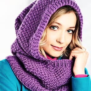 May include: A purple knitted cowl with a hood. The cowl is made of a soft, chunky yarn and has a simple, classic design.