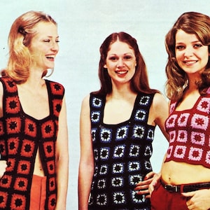 May include: Three women wearing sleeveless crocheted tops. The tops are made of squares in different colors and patterns. The woman on the left is wearing a red and black top, the woman in the middle is wearing a blue and white top, and the woman on the right is wearing a pink and white top.