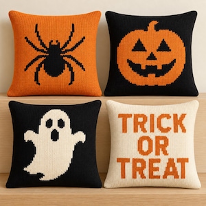 May include: A set of four square knit throw pillows featuring Halloween designs. One orange pillow has a black spider, one black pillow has an orange jack-o'-lantern, one black pillow has a white ghost, and one cream pillow has the text TRICK OR TREAT.