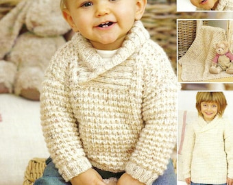 May include: A smiling child wearing a cream-colored, textured knit sweater with a shawl collar and blue jeans. The child is holding a teddy bear. Additional images show a matching hat and blanket.