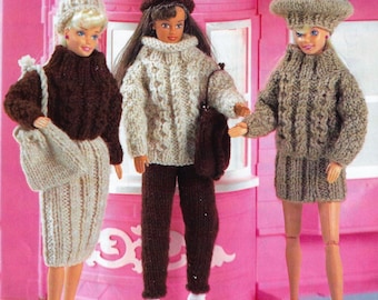May include: Three knitted doll outfits with matching hats. The outfits are brown, beige, and cream with cable knit patterns. The hats are brown, beige, and cream with pom-poms.