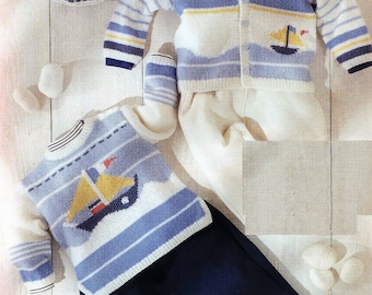 May include: A knitted baby outfit set in blue, white, and yellow with a sailboat design. The set includes a cardigan, a sweater, pants, and booties.