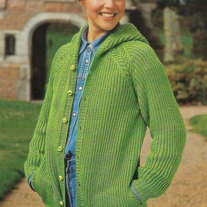 May include: A green hooded cardigan with a button closure and pockets. The cardigan is knitted and has a ribbed texture.