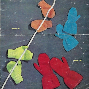 May include: A close-up of two pairs of knitted mittens. The first pair is green and the second pair is red. The mittens are hanging on a white rope. The text "Model 'A'" is in the top left corner of the image. The text "Model 'B'" is in the bottom right corner of the image.