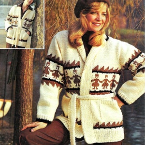 May include: A white knitted cardigan with a brown and black geometric pattern. The cardigan has a shawl collar, a tie belt, and two pockets.