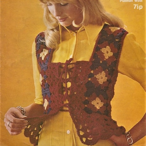 May include: A crocheted waistcoat with a tie fastening. The waistcoat is made with a combination of red, blue and yellow yarn. The waistcoat is being worn over a yellow shirt.