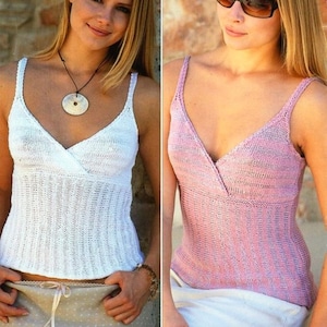 May include: Two women wearing sleeveless knit tops with a V-neckline. The top on the left is white and the top on the right is pink.