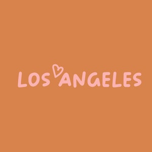 May include: A graphic design with the text "LOS ANGELES" in pink with a pink heart symbol between the words.