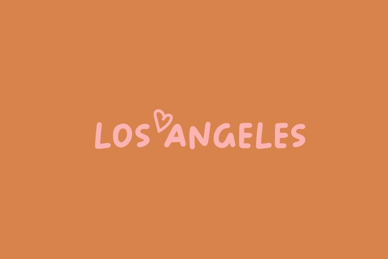 May include: A graphic design with the text "LOS ANGELES" in pink with a pink heart symbol between the words.