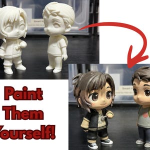 May include: Two unpainted chibi-style figurines of a boy and a girl, and two painted figurines of the same characters. The painted figurines have brown hair and are wearing casual clothes. The text "Paint Them Yourself!" is in the image.