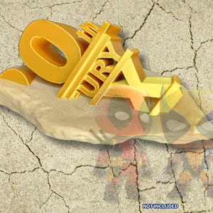 May include: A gold-colored 3D model of the number "0" with the words "The Fury" written on it. The model is sitting on a rock-like surface. The background is a cracked, beige surface.