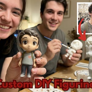 May include: A finished custom figurine of a person, held by a person. The figurine is wearing a gray shirt, dark pants, and a backpack. Another person is holding a white figurine and painting it. The image includes the text "Custom DIY Figurines".