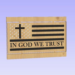May include: Wooden plaque featuring a stylized American flag design with a cross in the stars field and black stripes. The text "IN GOD WE TRUST" is prominently displayed below the stripes. The plaque is made of light-colored wood.