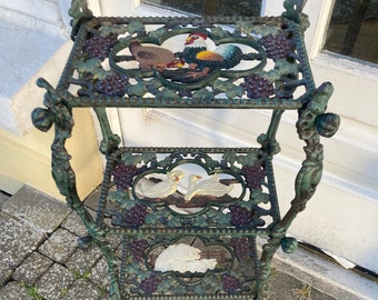 Vintage three tier farmyard themed cast iron occasional stand