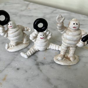Set of 3 vintage cast iron &#39;Michelin Man&#39; models