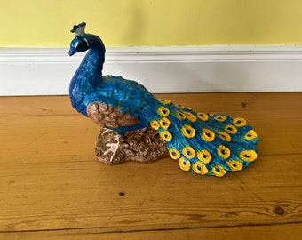 A beautifully hand painted victorian cast iron peacock garden ornament.