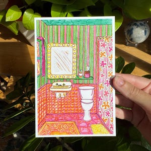 May include: A colorful illustration of a bathroom with a striped green and pink wall, orange tiled floor, and a white toilet. The artwork includes a mirror, sink, and floral shower curtain. The style is reminiscent of vintage art.