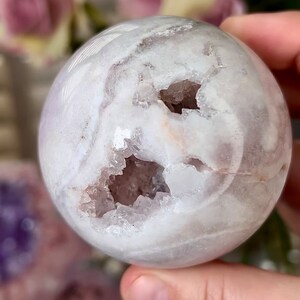 light pink amethyst sphere with chunky, druzy, teeth 380g