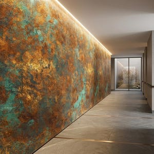 May include: An interior hallway with a textured wall featuring a blend of brown, gold, and teal colors. The wall is illuminated by a strip of light along the top. The floor is gray, and a glass door is visible at the end of the hall.