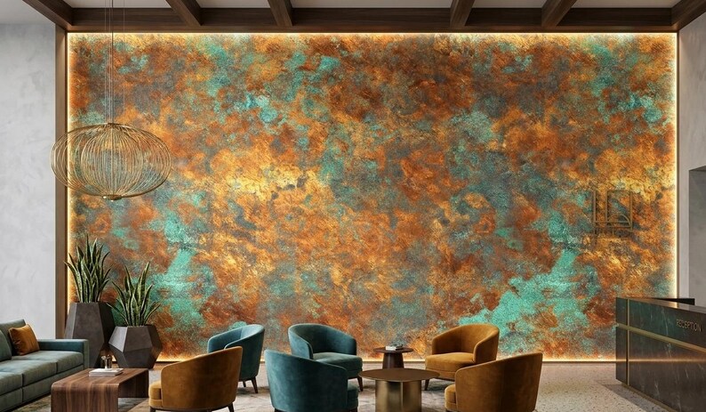 May include: A large wall panel featuring a textured, oxidized metal finish with vibrant swirls of copper, rust, and turquoise patina. The wall is backlit by perimeter lighting, creating a glowing effect behind the mottled, metallic surface.