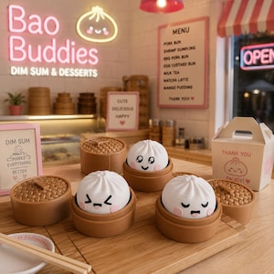 May include: A miniature food display featuring three white bao bun figurines with distinct facial expressions, each resting in a small brown bamboo-style steamer basket. The scene includes a takeout box, a menu board, and signs with text like Bao Buddies and Dim Sum Makes Everything Better.