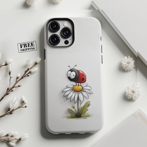May include: White phone case featuring a cartoon ladybug on a daisy. The ladybug is red and black with large eyes. The daisy has white petals and a yellow center. The case has a black camera module and black side buttons. The words "FREE SHIPPING" are in a black box.