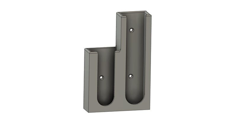 May include: A gray wall mount with two vertical slots for holding items. The slots are about 10 inches tall and 2 inches wide.