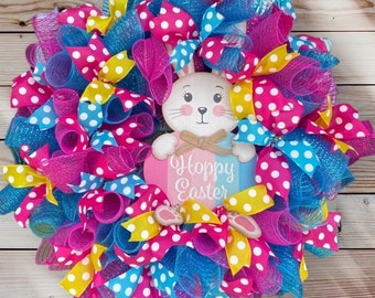 Easter wreath with bunny sign. Blue and pink Easter wreath