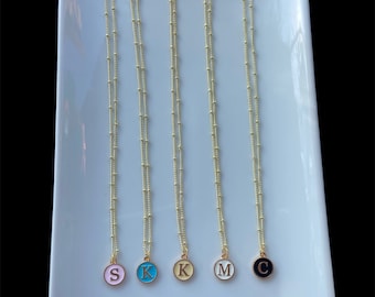 Personalized intial necklaces in five different colors