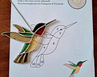 May include: A stained glass hummingbird pattern with numbered sections for a craft project. The pattern is 6.5 inches by 4 inches and can be adjusted in size. The pattern is for personal use only. The pattern is from Cactus Rose Glass Art on Instagram and Facebook.