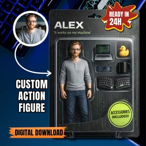 May include: A custom action figure of a man named Alex, packaged in a clear plastic blister pack. The figure is wearing a gray long-sleeve shirt and jeans. Accessories include a laptop, glasses, a rubber duck, a mug, and two keyboards. Text on the package reads "It works on my machine."