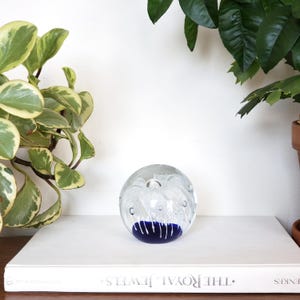 Vintage Paperweight Orb With White Flower On a Blue Bottom With Bubbles, Art Glass Ball Paperweight