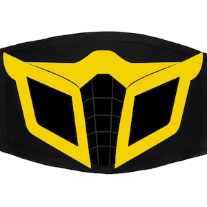 May include: Black face mask with a yellow design of a stylized mask with a grid pattern.