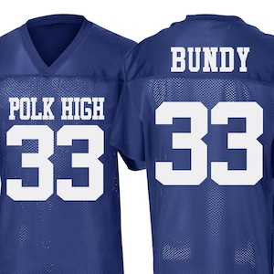 May include: A blue football jersey with white lettering. The front of the jersey says "POLK HIGH" and "33". The back of the jersey says "BUNDY" and "33".