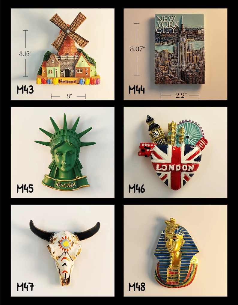 May include: A collection of decorative magnets featuring landmarks and cultural symbols. Includes a windmill scene (3" wide, 3.15" tall), a New York City skyline (2.2" wide, 3.07" tall), the Statue of Liberty, a London emblem, a skull, and a pharaoh.
